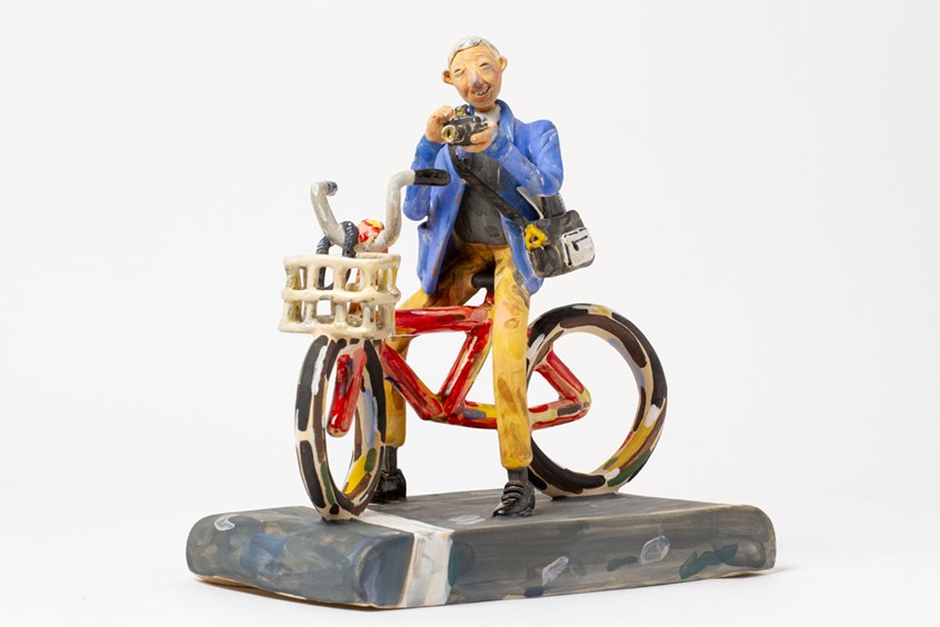 illustration of “Bike Shop” is an ongoing series of sculptures inspired by people from all walks of life, whose bike plays an important role.
This sculpture is a tribute to the humble and amazing photographer, Bill Cunningham, who was honest and true to himself, and a role model & inspiration to me.
*Bill Cunningham, Photographer, Bike, portrait, sculpture,