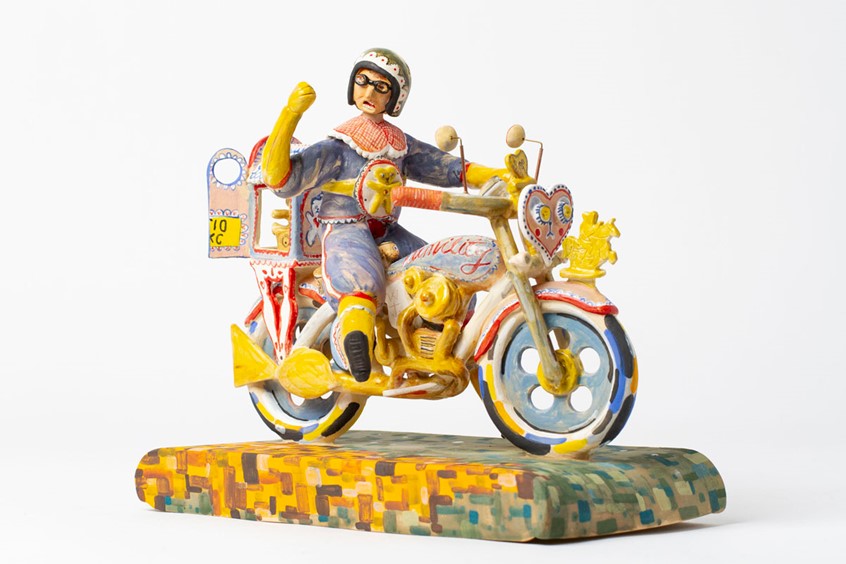illustration of “Bike Shop” is an ongoing series of sculptures inspired by people from all walks of life, whose bike plays an important role.
This sculpture is inspired by Grayson Perry and his childhood friend, Alan Measles.
*Grayson Perry, motorcycle, Kenilworth AM1, journey, portrait, sculpture, ceramics.