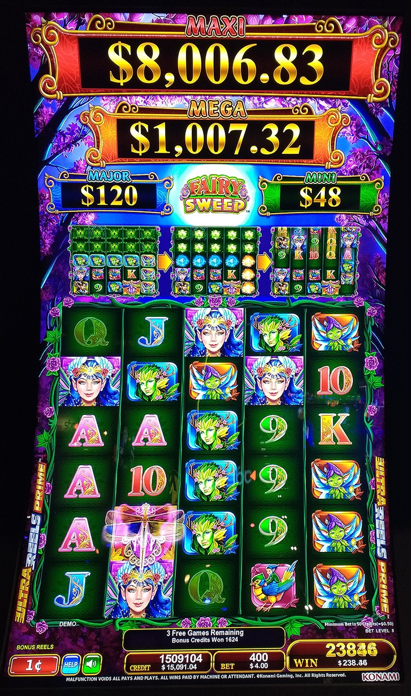 illustration of Fairy Sweep is a full-screen slot machine game that features a Fairy theme. Sandra was responsible for all the artwork except the logo and standard Konami card symbols. The game screen is framed by roses and thorns, against a purple, evening, enchanted forest background. Among the pic symbols are a green, pointy-eared elf (influenced by Brian Froud), a gnome riding a bird, the beautiful Fairy Queen and a dryad (tree person). This is the Feature Game.