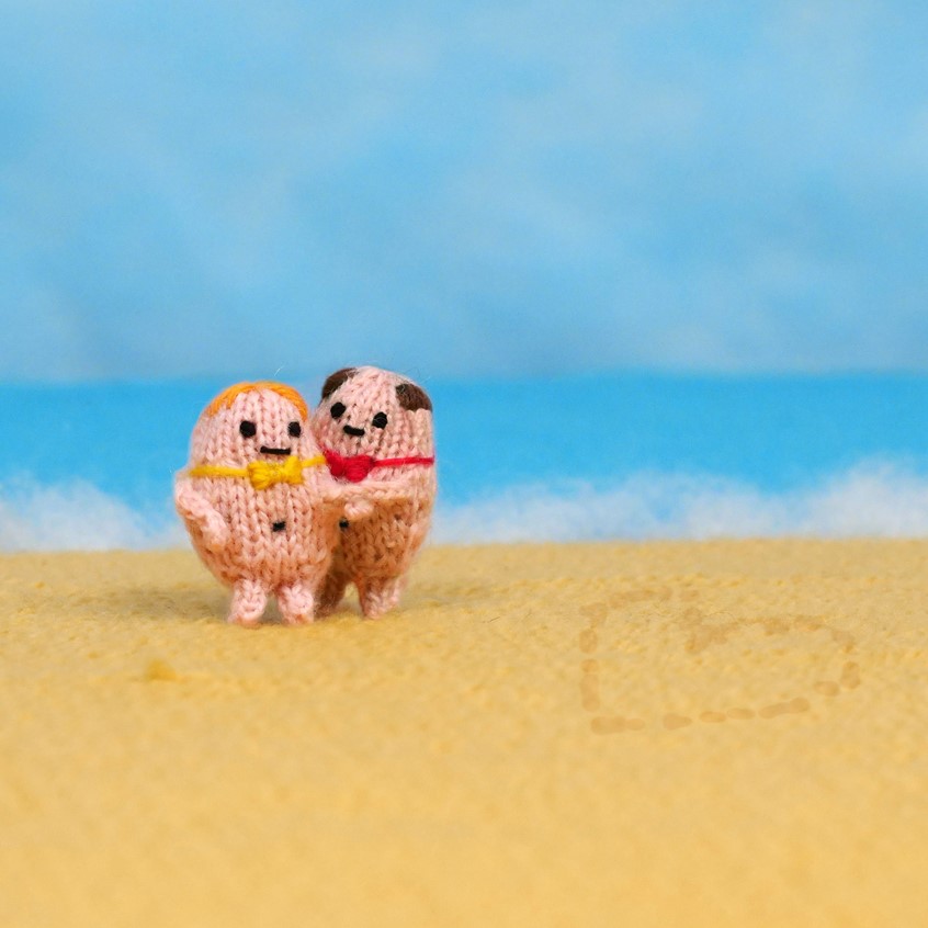 illustration of Couple On Beach.
blue sky, heart in sand, ocean background, loved up, loving couple, naked couple, knitting, fun character, cute knitting, fun gif, knitting toys, playful creatures, fantasy, soft sculptures, installations, knitting pattern, amusing, funny animation, handmade, hand knit, craft