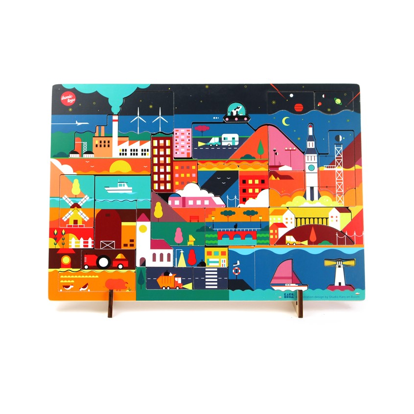 illustration of Puzzle made for Ikonic Toys. A3, 42 x 30 x 1 cm. Wooden design puzzle, consists out of 32 pieces. Two layered design puzzle that surprises you with an illustration related to the piece that was taken away.
Comes with 2 little stands to display the puzzle as a decorative object.