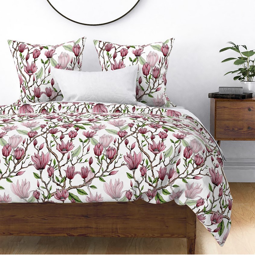 illustration of A beautiful Magnolia surface repeat pattern for a bedding and homewares collections. Botanical ink and watercolour detail. Floral trailing pattern. Magnolia flower in different stages, bud and full flower. Cluster on pink flowers.