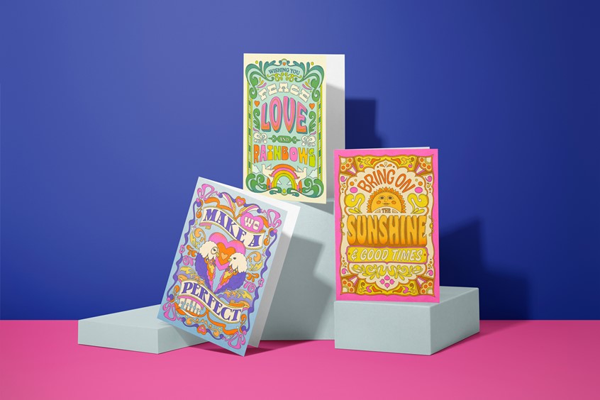 illustration of Hand lettered greeting card design series — 'Love, Peace & Rainbows', 'We Make a Perfect Pair' and 'Bring on the Sunshine & Good Times' — bold 1970s retro illustration with ornate ornamentation and vivid colour.